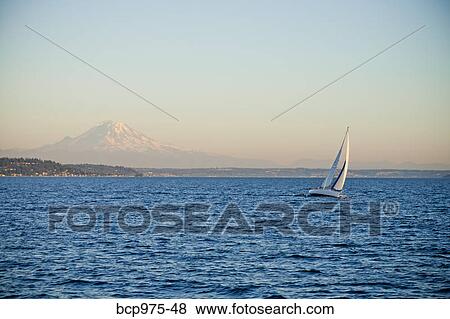 Mt. rainier behind sail boat on puget sound View Large Photo Image Stock Photo - Mt. rainier behind sail boat on puget sound. Fotosearch