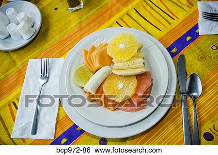 Place setting with plate of fruit View Large Photo Image Stock Photograph - Place setting with plate of fruit. Fotosearch