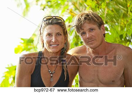 Portrait of couple in tropical location View Large Photo Image Stock Photo - Portrait of couple in tropical location. Fotosearch
