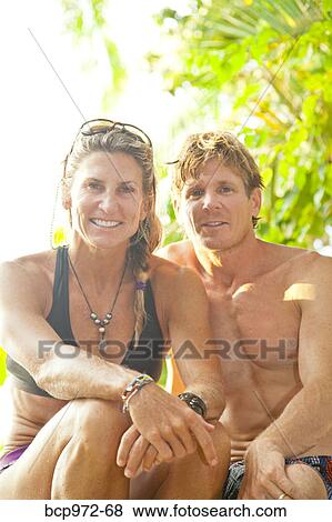 Portrait of couple in tropical location View Large Photo Image Stock Photo - Portrait of couple in tropical location. Fotosearch