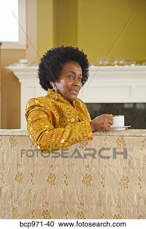 Portrait of elegant woman in gold jacket View Large Photo Image Stock Image - Portrait of elegant woman in gold jacket. Fotosearch