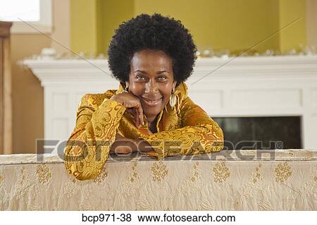 Portrait of elegant woman in gold jacket View Large Photo Image Stock Photo - Portrait of elegant woman in gold jacket. Fotosearch