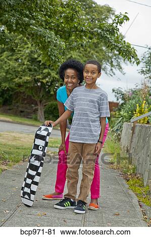 Portrait of mother and son outdoors View Large Photo Image Stock Image - Portrait of mother and son outdoors. Fotosearch