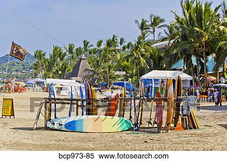 Racks of surfboards on beach at sayulita View Large Photo Image Stock Photography - Racks of surfboards on beach at sayulita. Fotosearch