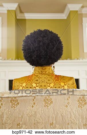 Rear view of woman with natural hairdo View Large Photo Image Stock Image - Rear view of woman with natural hairdo. Fotosearch