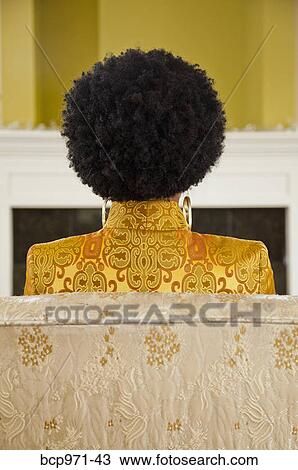 Rear view of woman with natural hairdo View Large Photo Image Stock Image - Rear view of woman with natural hairdo. Fotosearch