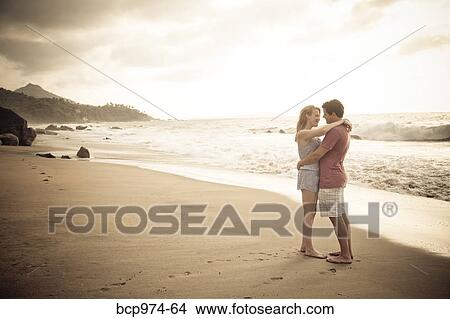 Romantic young couple on beach View Large Photo Image Picture - Romantic young couple on beach. Fotosearch