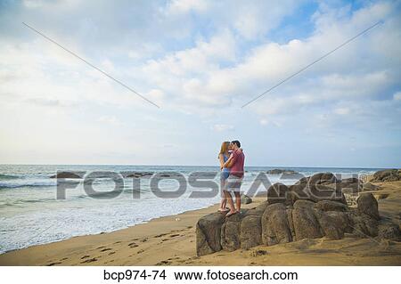 Picture - Romantic young couple on beach. Fotosearch