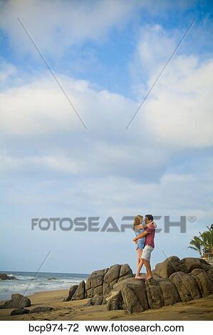 Romantic young couple on beach View Large Photo Image Stock Image - Romantic young couple on beach. Fotosearch