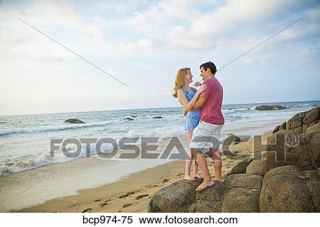 Romantic young couple on beach View Large Photo Image Stock Photography - Romantic young couple on beach. Fotosearch