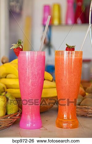 Stock Photograph - Row of colorful drinks on counter. Fotosearch