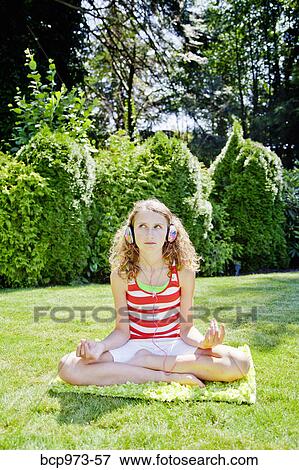 Teen girl meditating outdoors View Large Photo Image Stock Photo - Teen girl meditating outdoors. Fotosearch