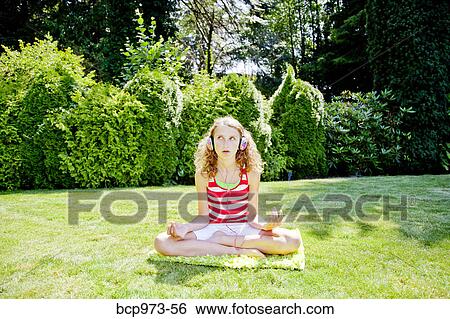 Teen girl meditating outdoors View Large Photo Image Stock Photograph - Teen girl meditating outdoors. Fotosearch