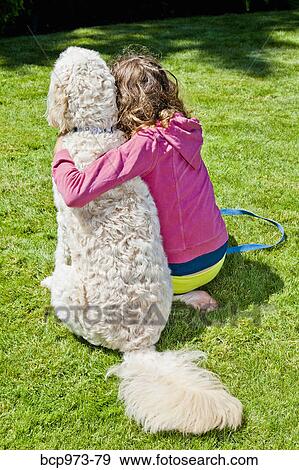 Teen girl with arm around white dog View Large Photo Image Stock Photo - Teen girl with arm around white dog. Fotosearch