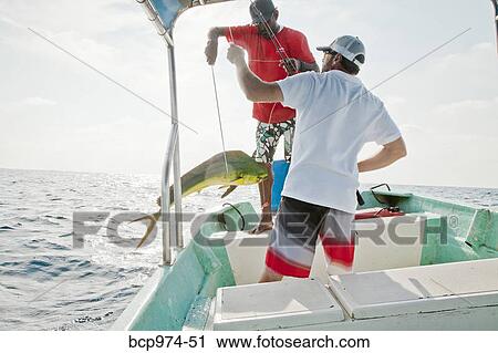 Two men on charter fishing boat View Large Photo Image Stock Image - Two men on charter fishing boat. Fotosearch