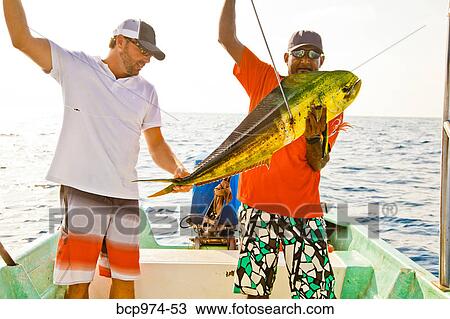 Two men on charter fishing boat View Large Photo Image Stock Image - Two men on charter fishing boat. Fotosearch