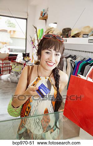 Woman shopping in boutique View Large Photo Image Stock Image - Woman shopping in boutique. Fotosearch