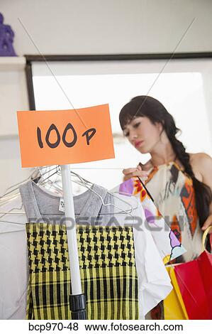 Woman shopping in boutique View Large Photo Image Stock Photo - Woman shopping in boutique. Fotosearch