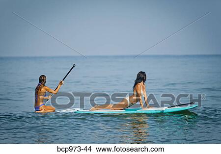 Women on paddle boards View Large Photo Image Picture - Women on paddle boards. Fotosearch