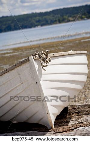 Wooden rowboat on beach View Large Photo Image Stock Photography - Wooden rowboat on beach. Fotosearch