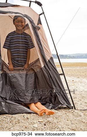 Young children playing in tent on beach View Large Photo Image Picture - Young children playing in tent on beach. Fotosearch