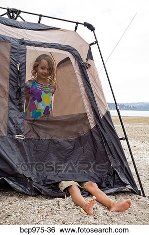 Young children playing in tent on beach View Large Photo Image Stock Photograph - Young children playing in tent on beach. Fotosearch