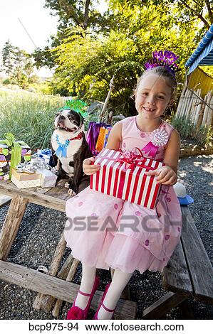 Young girl and dog at outdoor birthday paty View Large Photo Image Picture - Young girl and dog at outdoor birthday paty. Fotosearch