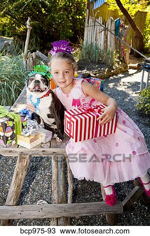Young girl and dog at outdoor birthday paty View Large Photo Image Stock Image - Young girl and dog at outdoor birthday paty. Fotosearch
