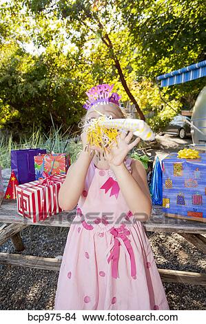 Picture - Young girl in birthday party outfit. Fotosearch