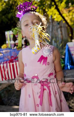 Stock Image - Young girl in birthday party outfit. Fotosearch