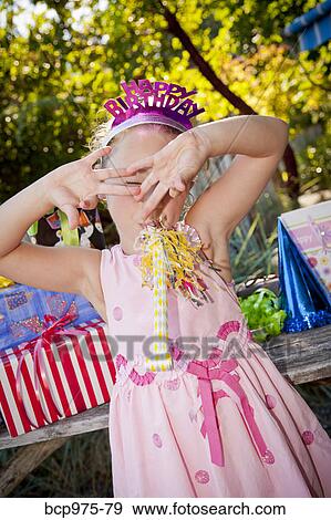 Stock Photo - Young girl in birthday party outfit. Fotosearch