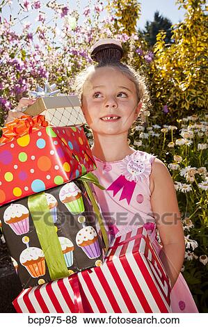 Stock Photo - Young girl in birthday party outfit. Fotosearch