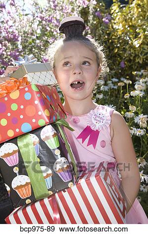 Young girl in birthday party outfit View Large Photo Image Stock Photo - Young girl in birthday party outfit. Fotosearch
