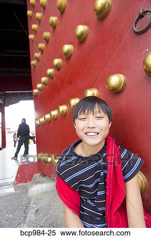 "Boy in front of the palace gates in the Forbidden City, Beijing, China" View Large Photo Image Stock Photography - "Boy in front of the palace gates in the Forbidden City, Beijing, China". Fotosearch