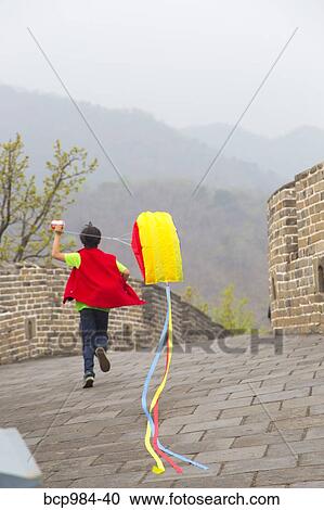 "Boy running with a kite on the Great Wall of China, at Mutianyu, Huairou, China" View Large Photo Image Stock Image - "Boy running with a kite on the Great Wall of China, at Mutianyu, Huairou, China". Fotosearch