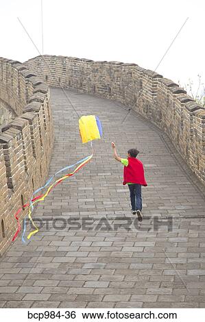 "Boy running with a kite on the Great Wall of China, at Mutianyu, Huairou, China" View Large Photo Image Stock Photograph - "Boy running with a kite on the Great Wall of China, at Mutianyu, Huairou, China". Fotosearch