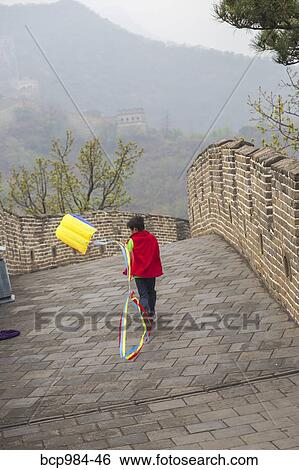 "Boy running with a kite on the Great Wall of China, at Mutianyu, Huairou, China" View Large Photo Image Stock Photograph - "Boy running with a kite on the Great Wall of China, at Mutianyu, Huairou, China". Fotosearch