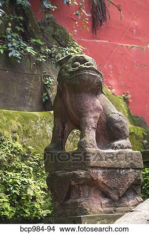 Picture - "Carved stone dog at a monastery, Leshan, Sichuan province, China". Fotosearch
