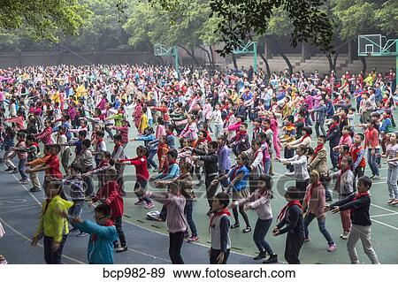 Children do morning exercise at a Chinese primary school View Large Photo Image Stock Photo - Children do morning exercise at a Chinese primary school. Fotosearch