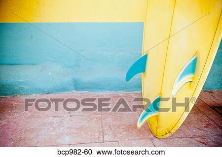 "Close up of a yellow, tri-fin, vintage surfboard" View Large Photo Image Stock Image - "Close up of a yellow, tri-fin, vintage surfboard". Fotosearch