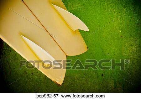 Close up of a yellow twin fin swallowtail surfboard View Large Photo Image Stock Photo - Close up of a yellow twin fin swallowtail surfboard. Fotosearch