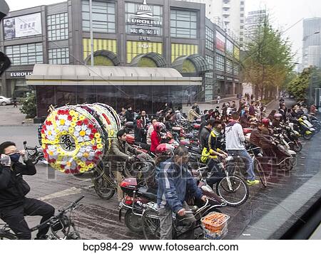 "Cyclists and pedestrians on a busy Chengdu street, China" View Large Photo Image Stock Photo - "Cyclists and pedestrians on a busy Chengdu street, China". Fotosearch