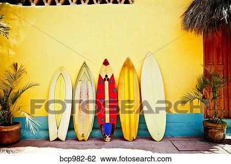 "Five patterned, vintage surfboards leaning against a wall" View Large Photo Image Stock Image - "Five patterned, vintage surfboards leaning against a wall". Fotosearch