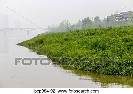 "Misty bridge and a riverside village, Leshan, Sichuan province, China" View Large Photo Image Stock Image - "Misty bridge and a riverside village, Leshan, Sichuan province, China". Fotosearch