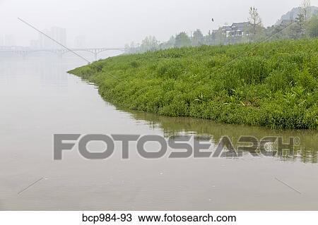 "Misty bridge and a riverside village, Leshan, Sichuan province, China" View Large Photo Image Stock Image - "Misty bridge and a riverside village, Leshan, Sichuan province, China". Fotosearch