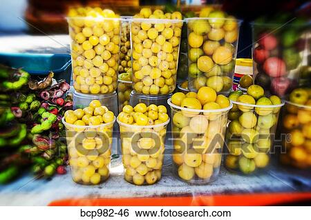 Nancy or nanches fruit in containers for sale View Large Photo Image Stock Photograph - Nancy or nanches fruit in containers for sale. Fotosearch