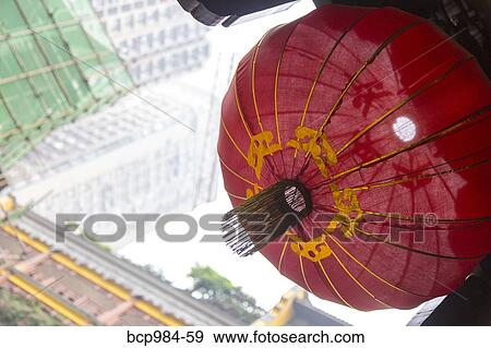 "New building construction seen behind a red temple lantern, Chongqing, China" View Large Photo Image Stock Photo - "New building construction seen behind a red temple lantern, Chongqing, China". Fotosearch