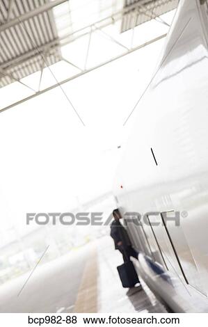 Passenger boarding a train at Chengdu railway station View Large Photo Image Stock Photo - Passenger boarding a train at Chengdu railway station. Fotosearch