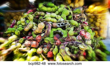 Stock Photo - Pile of guamuchil fruit for sale. Fotosearch