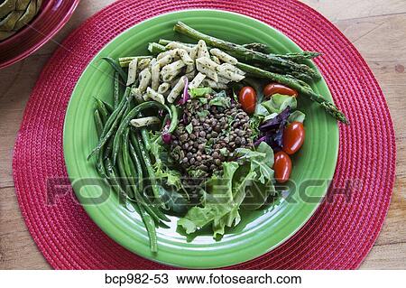 Stock Image - "Plate of pasta, lentils, and fresh vegetables". Fotosearch